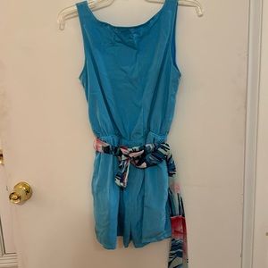 Blue romper with tropical sash. Size S. In good condition.
